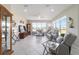 Bright living room featuring large windows and tile flooring and stylish, neutral furnishings at 13146 Se 91St Court Rd, Summerfield, FL 34491