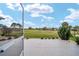 Scenic view of the lush green golf course from the lanai, perfect for golf enthusiasts and enjoying outdoor activities at 13146 Se 91St Court Rd, Summerfield, FL 34491