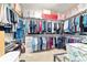 Walk-in closet offers ample storage, organized shelving, and room for clothing and accessories at 13146 Se 91St Court Rd, Summerfield, FL 34491