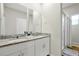 Bathroom features granite-topped double vanity and modern glass shower at 140 S Zuni Rd, St Cloud, FL 34771