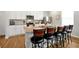 Well-equipped kitchen with stainless steel appliances, granite countertops, and seating at the island at 140 S Zuni Rd, St Cloud, FL 34771