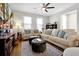 Cozy living room featuring plush seating, a decorative rug, and ample natural light at 140 S Zuni Rd, St Cloud, FL 34771