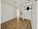 Bedroom features closet and door to the hallway and marble-style floors at 15747 Old Highway 50, Clermont, FL 34711