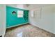 Small bedroom featuring colorful wall art and marble-style floors at 15747 Old Highway 50, Clermont, FL 34711