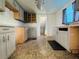 A partially renovated kitchen with grey cabinets and stainless steel hardware at 15747 Old Highway 50, Clermont, FL 34711