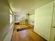 A living room with stairs, hardwood floors, and a window providing natural light at 15747 Old Highway 50, Clermont, FL 34711