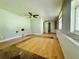 A sunlit living room with hardwood floors and a ceiling fan at 15747 Old Highway 50, Clermont, FL 34711