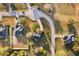 Aerial view of a home on a well-manicured lot, featuring a circular driveway and a quiet neighborhood at 1603 Brookstone Ln, Fruitland Park, FL 34731