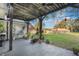 Backyard patio with outdoor seating surrounded by lush greenery at 1603 Brookstone Ln, Fruitland Park, FL 34731