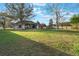 Large backyard with trees and landscaping offers a private outdoor space at 1603 Brookstone Ln, Fruitland Park, FL 34731