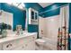 Bathroom with turquoise walls, shower-tub combination, and sink vanity at 1603 Brookstone Ln, Fruitland Park, FL 34731