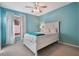 Bright bedroom with blue walls, white trim, and a window view at 1603 Brookstone Ln, Fruitland Park, FL 34731