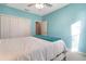 Bedroom with a large closet and light-blue walls at 1603 Brookstone Ln, Fruitland Park, FL 34731
