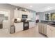 Well-lit kitchen with stainless steel appliances, and modern cabinets at 1603 Brookstone Ln, Fruitland Park, FL 34731