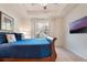 Comfortable main bedroom with tray ceilings, a ceiling fan, and a lovely view out the windows at 1603 Brookstone Ln, Fruitland Park, FL 34731