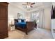 Bright main bedroom featuring a trey ceiling, a bed with blue bedding, and a ceiling fan at 1603 Brookstone Ln, Fruitland Park, FL 34731