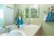 Bathroom featuring double sinks and a large mirror at 1617 Lakewood Dr, The Villages, FL 32162