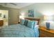 Bedroom featuring a ceiling fan and modern décor for a relaxing ambiance at 1617 Lakewood Dr, The Villages, FL 32162
