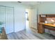 Bedroom featuring a wooden desk and light grey wood-look floors at 1617 Lakewood Dr, The Villages, FL 32162