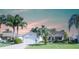 Charming single Gathering home with a well-manicured lawn and mature palm trees at 1617 Lakewood Dr, The Villages, FL 32162