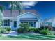 Up-close view of the home's entrance and the surrounding landscaping at 1617 Lakewood Dr, The Villages, FL 32162
