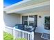 Cozy front porch with chairs and a table, perfect for relaxing outdoors at 1617 Lakewood Dr, The Villages, FL 32162
