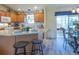 Open kitchen with a breakfast bar, modern appliances, and plenty of cabinet space at 1617 Lakewood Dr, The Villages, FL 32162