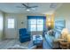 Cozy living room with plenty of natural light, comfortable seating, and modern decor at 1617 Lakewood Dr, The Villages, FL 32162