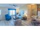 Bright living room with comfortable seating, new floors, and an open layout at 1617 Lakewood Dr, The Villages, FL 32162