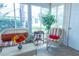 Bright sunroom with wicker furniture and views of the outdoors at 1617 Lakewood Dr, The Villages, FL 32162