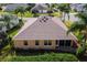 Aerial of the home showing the back lanai and a well maintained roof in an established neighborhood at 1619 Duffy Loop, The Villages, FL 32162