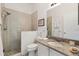 Bathroom featuring a tiled shower, and a vanity with solid surface countertop and sink at 1622 Valley Falls Way, The Villages, FL 32162