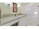 Bathroom featuring a glass-enclosed shower and vanity with a solid surface countertop at 1622 Valley Falls Way, The Villages, FL 32162