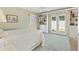 Cozy bedroom with built-in bookshelves, access to the garden, and soft, natural light at 1622 Valley Falls Way, The Villages, FL 32162