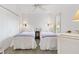 Comfortable bedroom with twin beds, bedside lamps, and a bright, airy feel at 1622 Valley Falls Way, The Villages, FL 32162