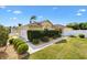 Well maintained home featuring manicured lawn, trimmed hedges, and attached two-car garage at 1622 Valley Falls Way, The Villages, FL 32162