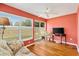 Sunroom with bright walls, hardwood floors, ceiling fan, and access to the outdoors at 1622 Valley Falls Way, The Villages, FL 32162