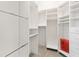 Organized walk-in closet with ample shelving and hanging space for storage at 1622 Valley Falls Way, The Villages, FL 32162