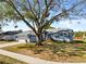 Charming one-story home with a well-manicured front yard and mature shade tree at 1676 E Spring Ridge Cir, Winter Garden, FL 34787