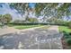 Enjoy outdoor recreation with the community lawn bowling area surrounded by lush landscaping and shaded seating at 16865 Se 94Th Sunnybrook Cir, The Villages, FL 32162
