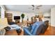 Spacious living room with hardwood floors and comfortable seating at 16865 Se 94Th Sunnybrook Cir, The Villages, FL 32162