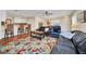 Open-concept living room with hardwood floors and view of the kitchen at 16865 Se 94Th Sunnybrook Cir, The Villages, FL 32162