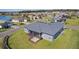 Overhead view of a home showcasing the screened in porch and landscape in a residential neighborhood at 17204 Se 112Th Court Rd, Summerfield, FL 34491