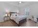 Bedroom with hardwood floors, a ceiling fan, and lots of natural light at 17204 Se 112Th Court Rd, Summerfield, FL 34491