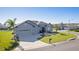 Street view of home with a three car garage, front yard landscaping and a circle driveway at 17204 Se 112Th Court Rd, Summerfield, FL 34491