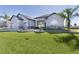 Charming single-story home with well-manicured lawn, attractive landscaping, and neutral-tone exterior at 17204 Se 112Th Court Rd, Summerfield, FL 34491