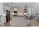 Modern kitchen with stainless steel appliances, granite countertops, and ample cabinet space at 17204 Se 112Th Court Rd, Summerfield, FL 34491