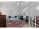 Bright and airy living room with large windows, comfortable seating, and an elegant area rug at 17204 Se 112Th Court Rd, Summerfield, FL 34491
