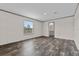 This bedroom is spacious with modern wood-look flooring and a window with natural light at 17442 Eve Dr, Montverde, FL 34756