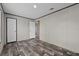 Spacious bedroom with wood-look flooring and white doors at 17442 Eve Dr, Montverde, FL 34756